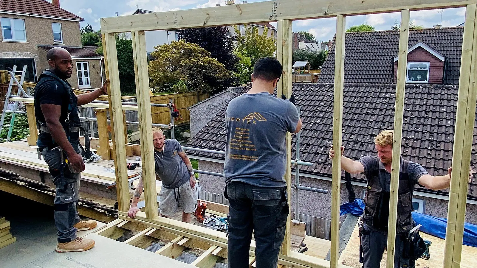 Wilson & Cole carpenters raising a dormer frame on a Bristol roof during a permitted development loft conversion