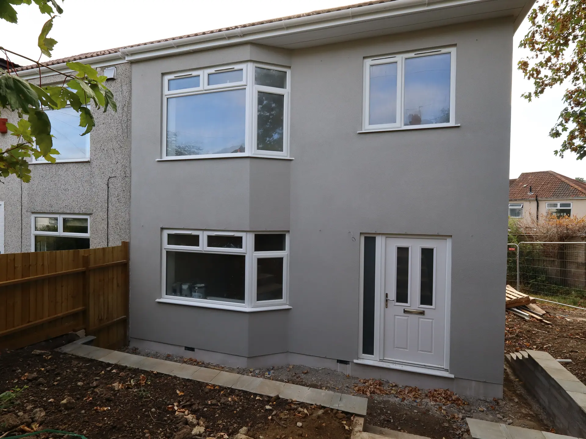 Finished bay-fronted new-build home on Sherwell Road, Brislington, in grey render