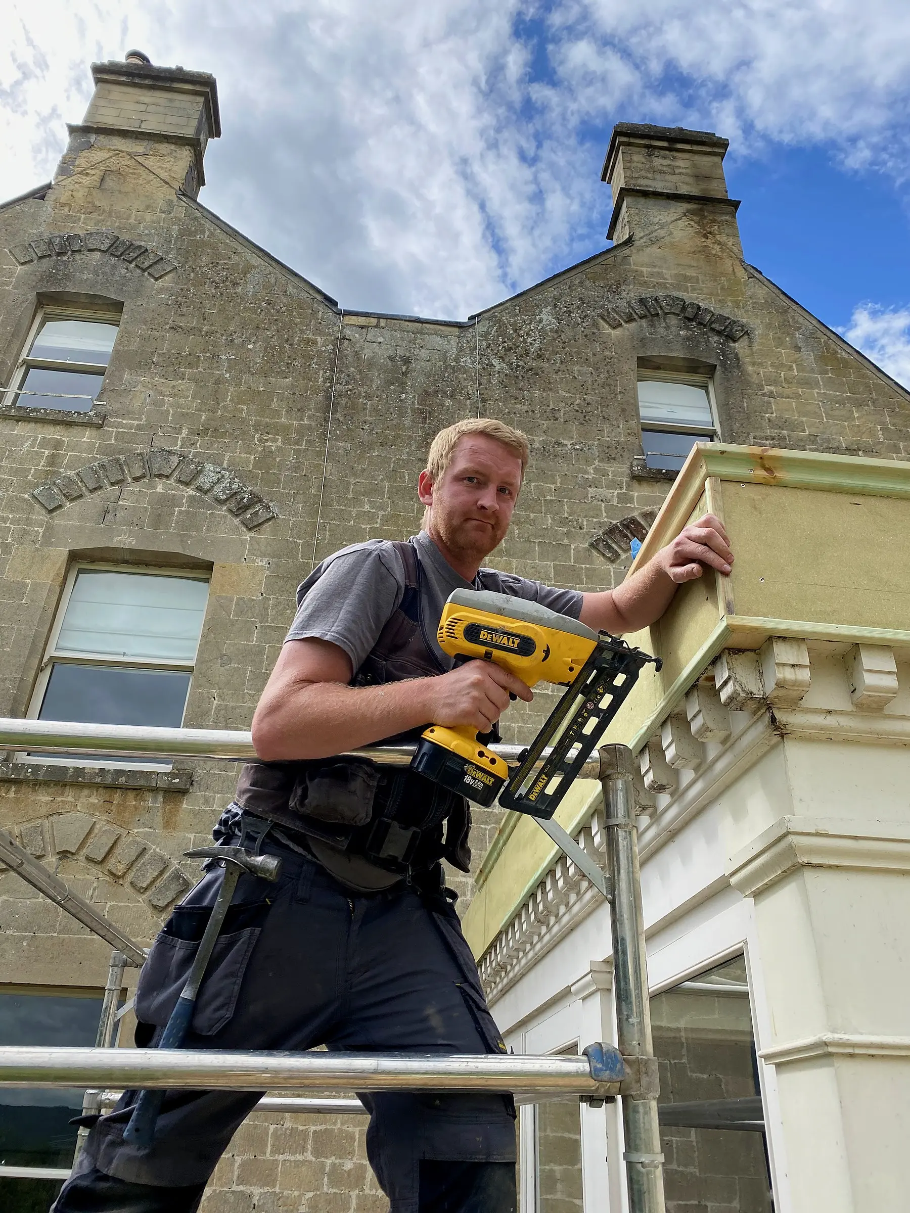 One of the Wilson & Cole founders working on scaffold